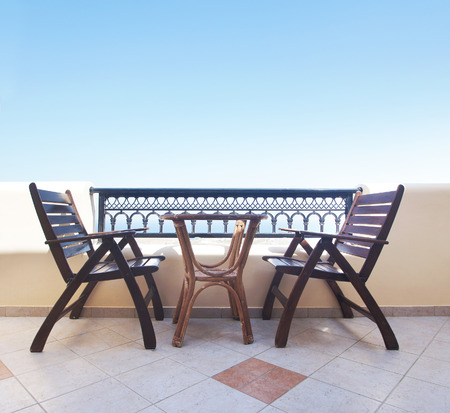 Two chairs on the balcony: Santorini resortの写真素材
