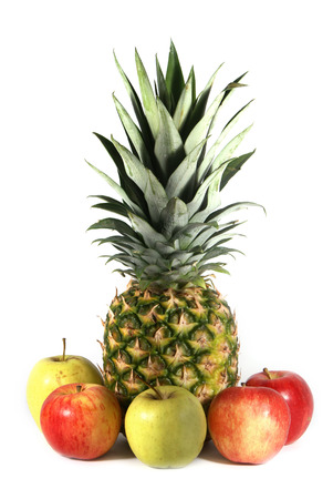 Pineapple and apples isolated on white backgroundの写真素材