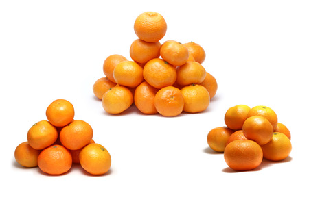 Yellow sweet tangerines and oranges isolated on white backgroundの写真素材