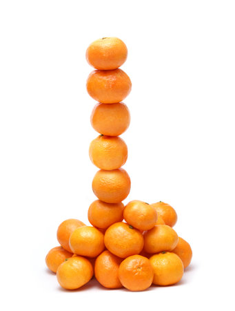 Tower of tangerines isolated on whiteの写真素材
