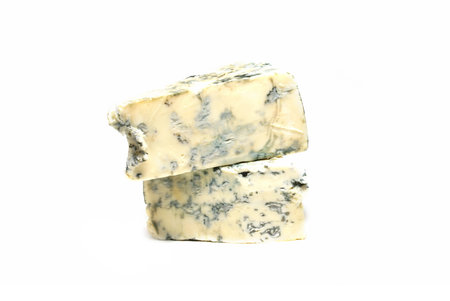 Parmesan cheese with mould isolated on whiteの写真素材