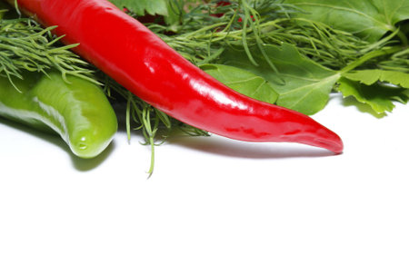 Red hot and green sweet peppers in saladの写真素材