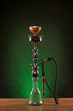 Exotic hookah with the fruit on the top over vintage backgroundの写真素材