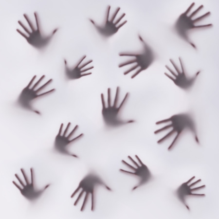 Frightening silhouette of many different handsの写真素材