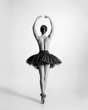 Black and white trace of young beautiful topless ballet dancer isolated over white backgroundの写真素材