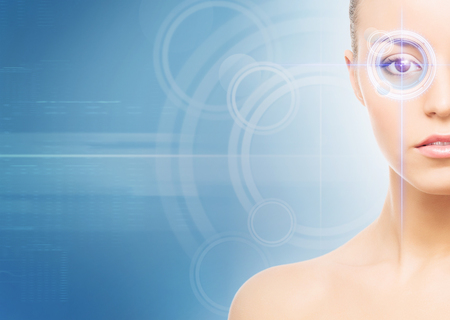 Close-up portrait of young and beautiful woman with the virtual hologram on her eyes (laser medicine and security technology concept)の写真素材