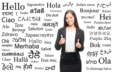 Young attractive woman over the background with a different world languages (language school concept)の写真素材