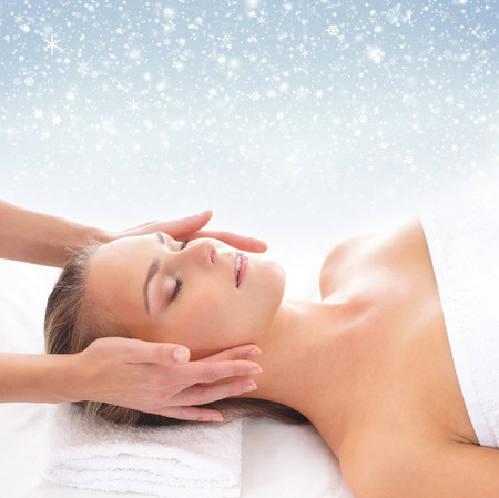 Beautiful and healthy woman in spa. Massage and healing. Winter concept.の写真素材