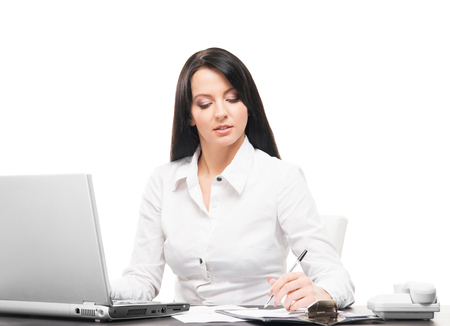 Young and attractive business woman working in office isolated on whiteの写真素材