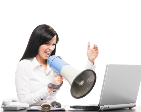 Angry and furious business woman screaming isolated on whiteの写真素材