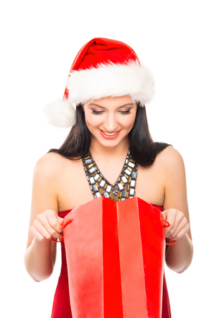 Young and beautiful Christmas shopper girl isolated on white backgroundの写真素材