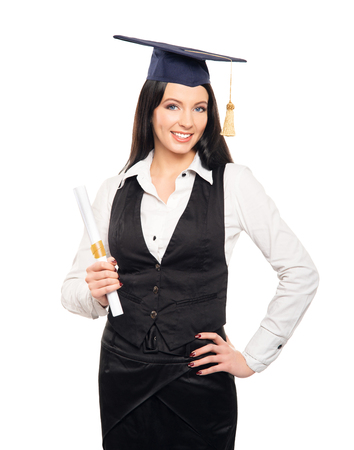 Young, beautiful and happy graduate girl holding degree diploma and smiling isolated on whiteの写真素材