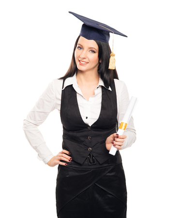 Young, beautiful and happy graduate girl holding degree diploma and smiling isolated on whiteの写真素材