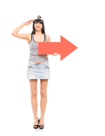 Young, beautiful and sexy sailor girl with a red arrow isolated on white backgroundの写真素材
