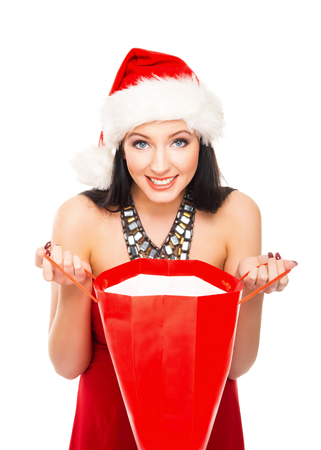 Young and beautiful Christmas shopper girl isolated on white backgroundの写真素材