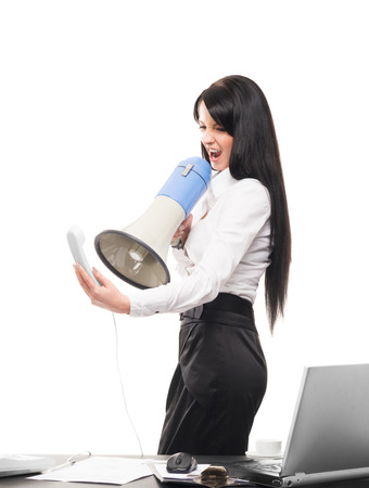 Angry and furious business woman screaming isolated on whiteの写真素材