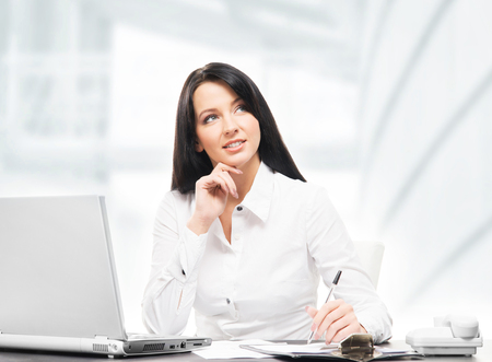 Young and attractive business woman working in officeの写真素材