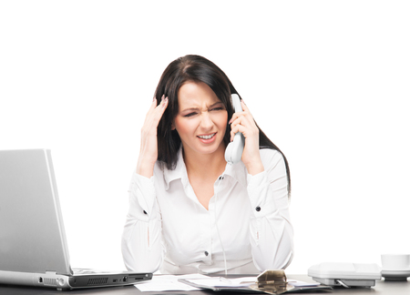 Young and attractive business woman working in office isolated on whiteの写真素材