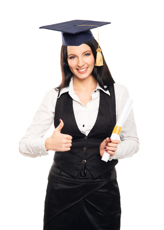 Young, beautiful and happy graduate girl holding degree diploma and smiling isolated on whiteの写真素材