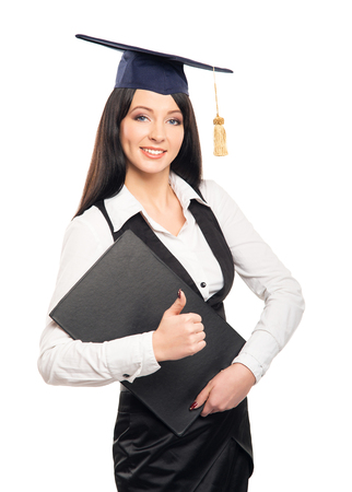 Young, beautiful and happy graduate girl holding degree diploma and smiling isolated on whiteの写真素材