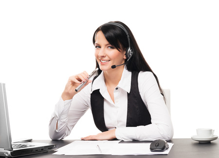 Young and attractive business woman with an electronic cigarette working in office isolated on whiteの写真素材