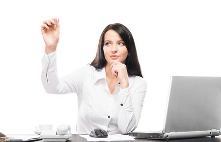 Young and attractive business woman working in office isolated on whiteの写真素材