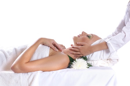 Young sexy blond getting spa treatment isolated on whiteの写真素材