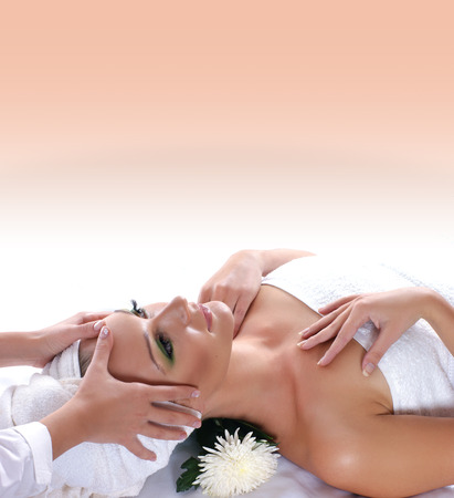 Young attractive sexy blond getting spa treatment over blue backgroundの写真素材
