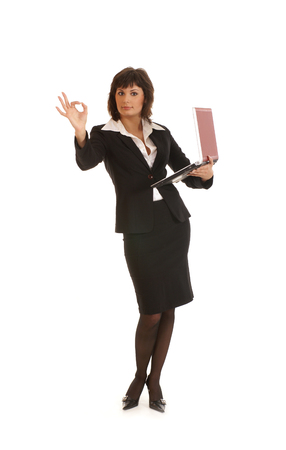 Attractive businesswoman with notebook isolated on whiteの写真素材