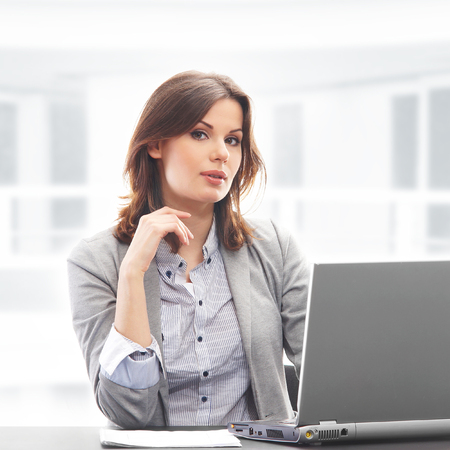 Business woman working in office on whiteの写真素材