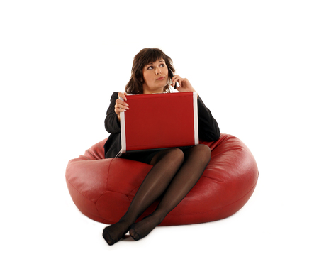 Attractive businesswoman with notebook isolated on whiteの写真素材