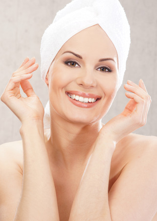 Young attractive woman in towelの写真素材