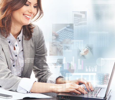Young business woman working in digital interfaceの写真素材