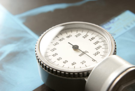 sphygmomanometer over medical background