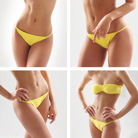 Stock photo of young, fit and sexy woman in yellow swimsuitの写真素材