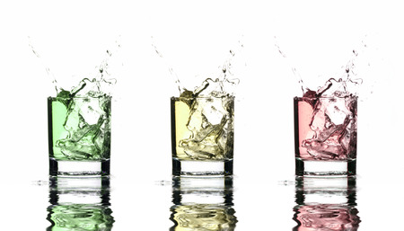 Beautiful splash of ice in the glass isolated on white backgroundの写真素材