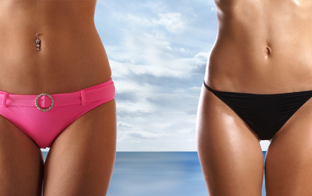 Sexy belly isolated on whiteの写真素材