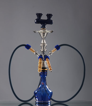 Ancient hookah over grey background