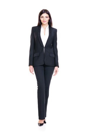 Young, confident, successful and beautiful business woman isolated on white. Occupation, career, job concept.の写真素材