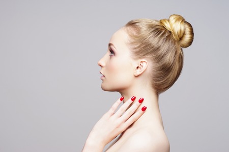 Beauty close-up portrait of beautiful, fresh and healthy girl over grey background.の写真素材