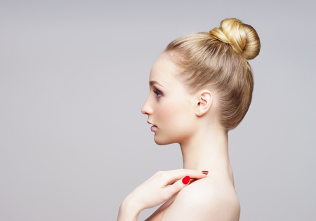 Beauty close-up portrait of beautiful, fresh and healthy girl over grey background.の写真素材