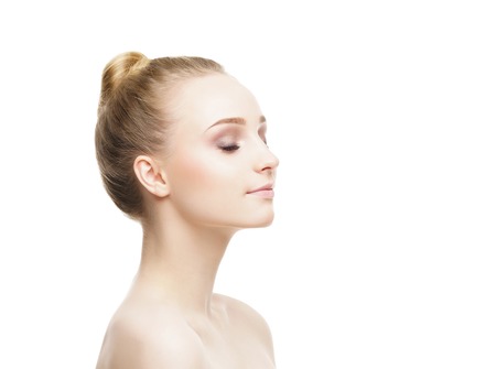 Beauty close-up portrait of baeautiful, fresh and healthy girl. Human face isolated on white.の写真素材