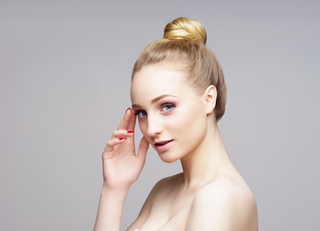 Beauty close-up portrait of beautiful, fresh and healthy girl over grey background.の写真素材
