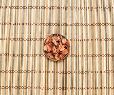Plate with aroma petals on bamboo mat. Spa, beauty, treatment concept.の写真素材