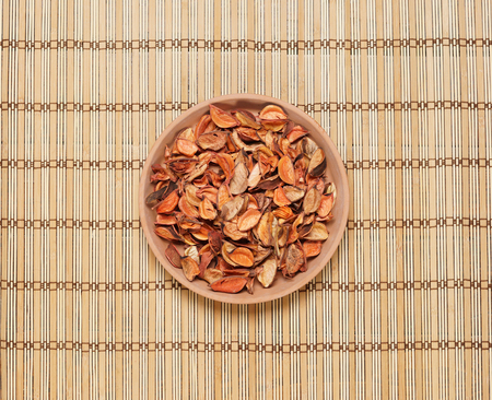 Plate with aroma petals on bamboo mat. Spa, beauty, treatment concept.の写真素材