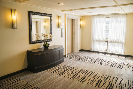 Stylish hallway in modern residence with rich furniture and carpet.の写真素材