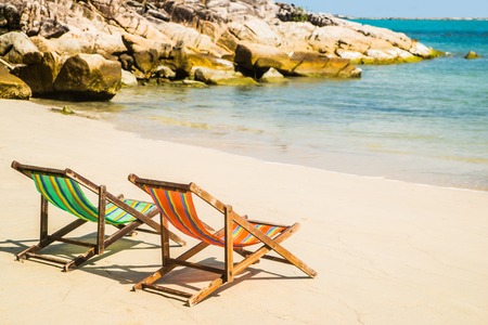 Lounge chairs on a tropical beach at summer.の写真素材