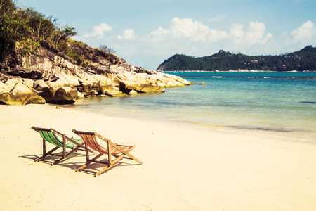 Lounge chairs on a tropical beach at summer.の写真素材