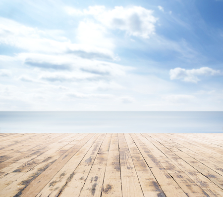 Wooden pier, exotic sea and a blue sky. Beautiful summer background. Vacation and traveling concept.の写真素材
