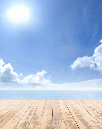 Wooden pier, exotic sea and a blue sky. Beautiful summer background. Vacation and traveling concept.の写真素材